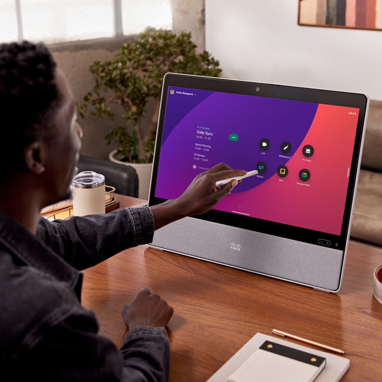 Remote worker using Stylus Pen with Webex Desk Pro