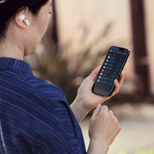 person outside using mobile phone for Webex calling