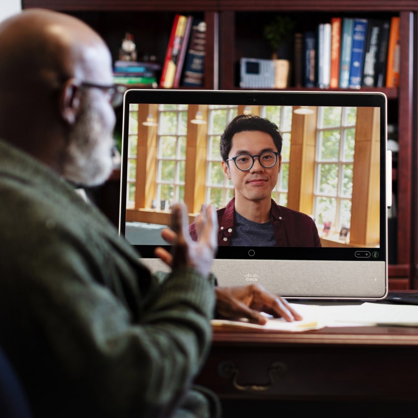 A professor meets with a student using Webex