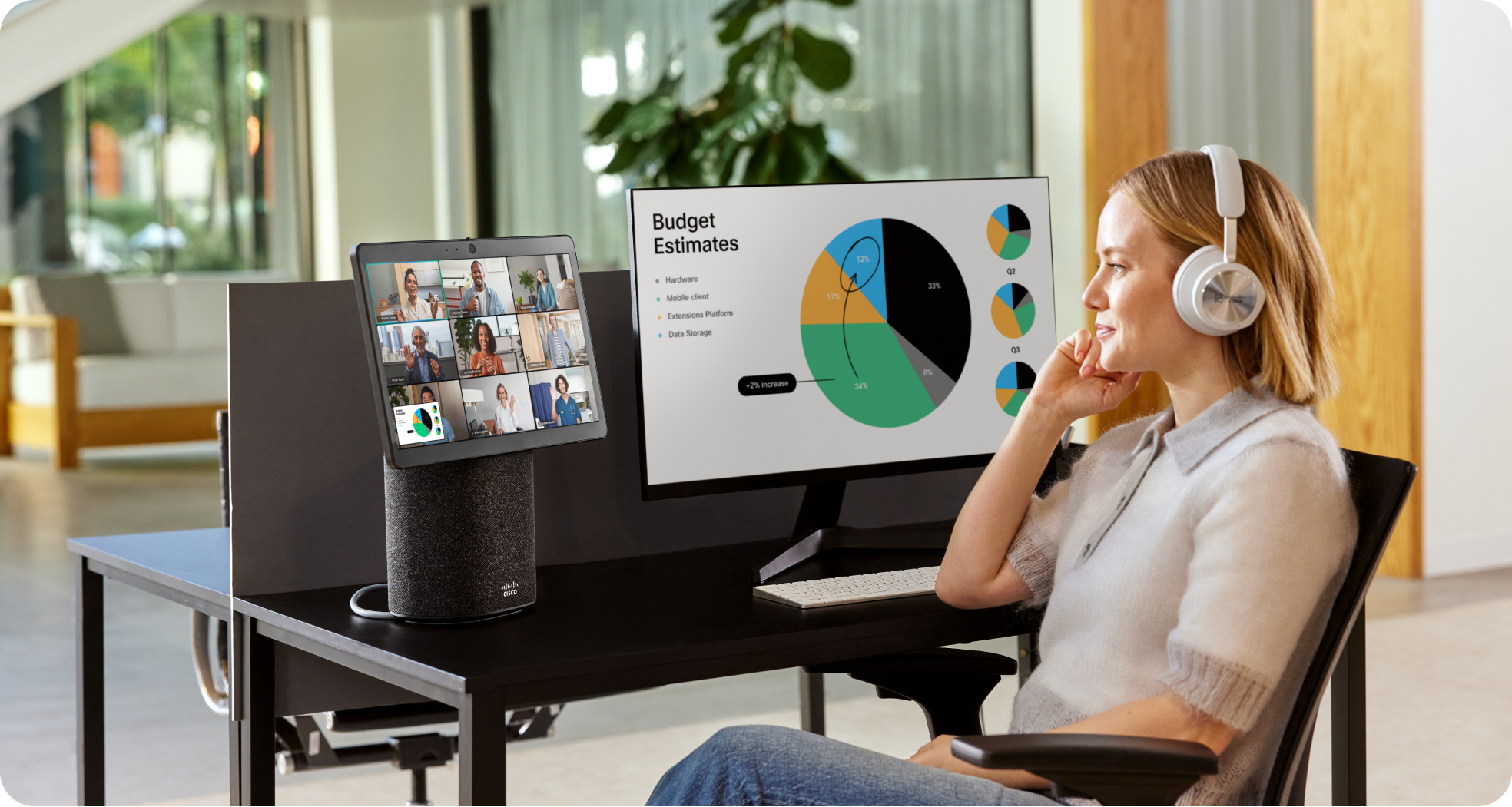 Person collaborates in a conference room via Webex Meetings on a laptop.