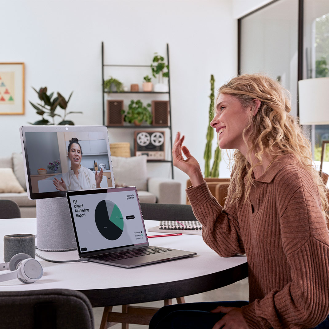 Person in a video meeting with laptop