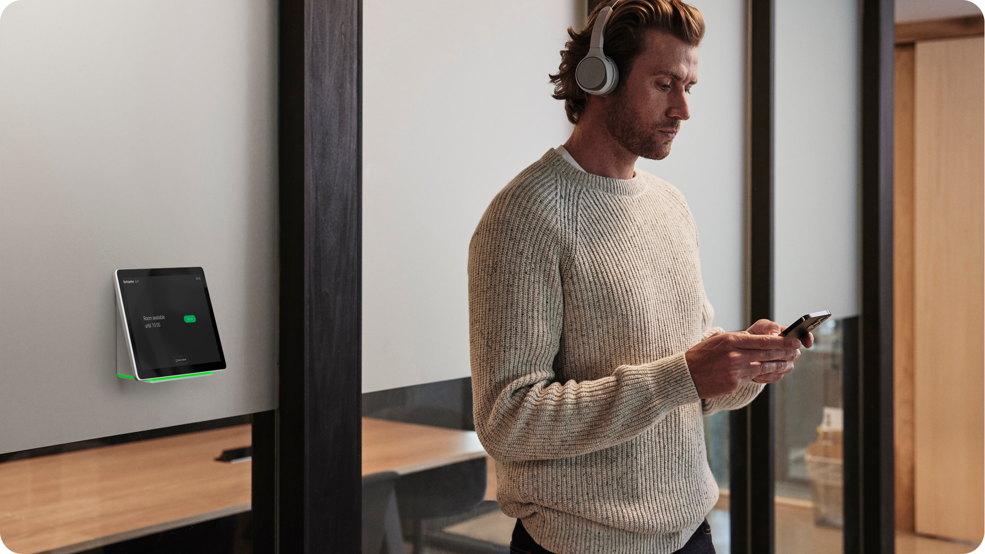 A professional collaborates on a digital whiteboard, editing it from his mobile phone.