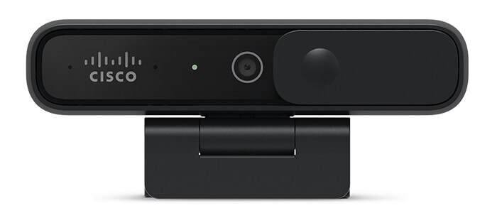 Cisco Desk Camera 1080p in the Carbon color, shown from front, with green light indicating it's on. Privacy shutter is open.