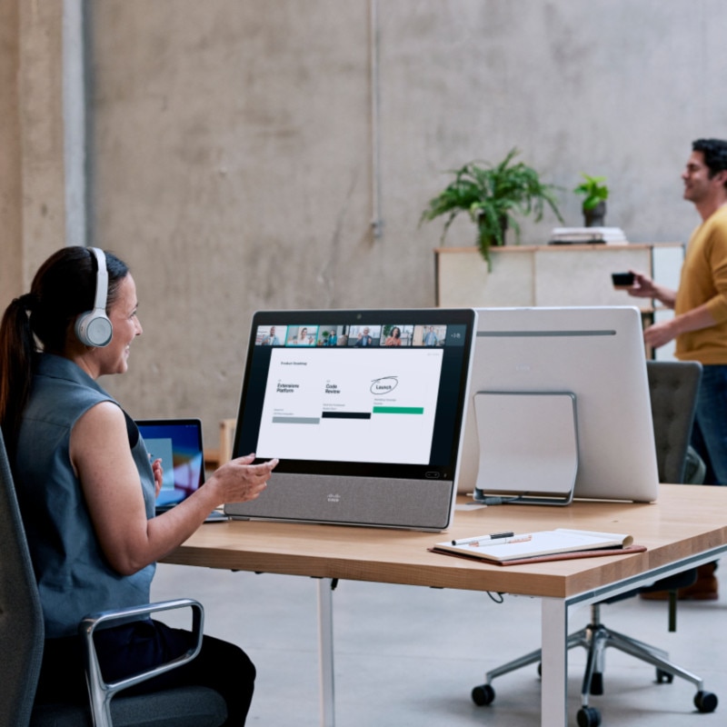 person working at desk with desk pro device