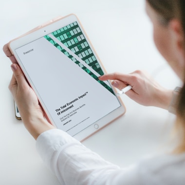 person reading report on iPad