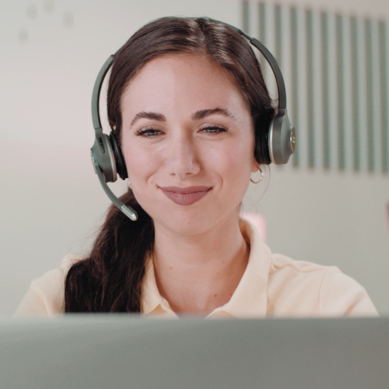 satisfied looking representative/agent working at desk