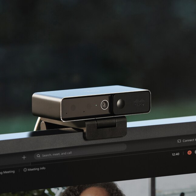 a Webex Camera is shown mounted on top of a computer monitor.