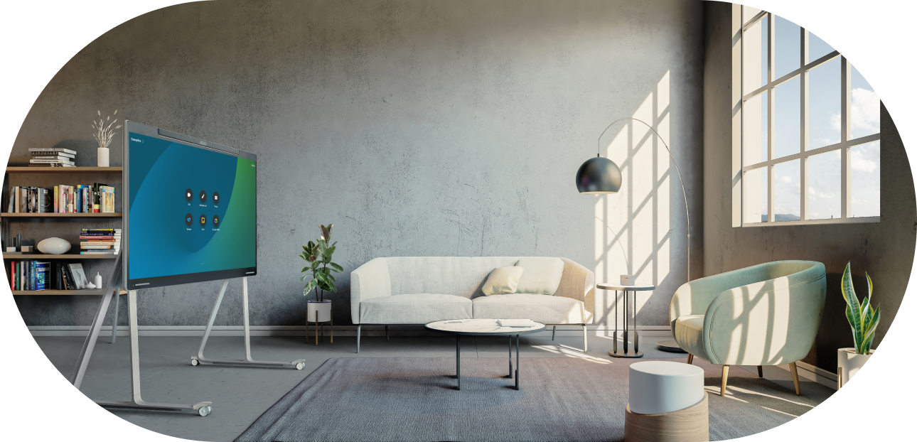 An open ideation space in an office with a couch, aimchair, and a digital whiteboard for brainstorming and collaboration.
