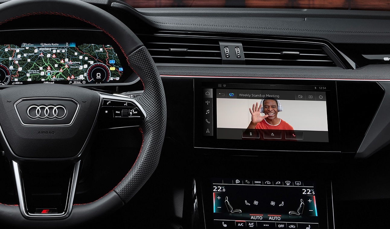 Audi dashboard displays Webex video conference.