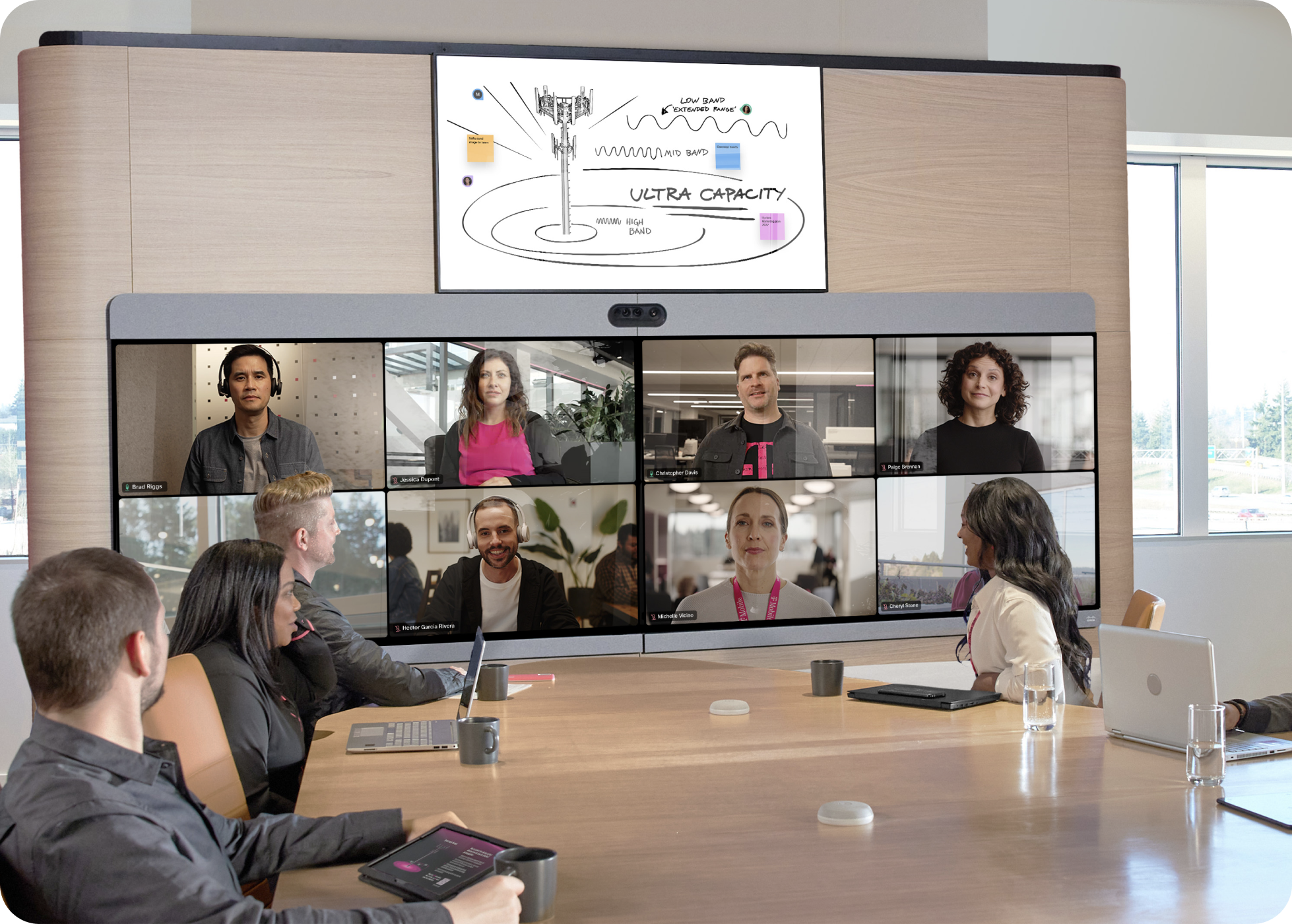 T-Mobile employees collaborate in a meeting and whiteboard their ideas with the help of Webex.