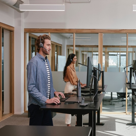 Team members in the office connect with others via Webex Calling.