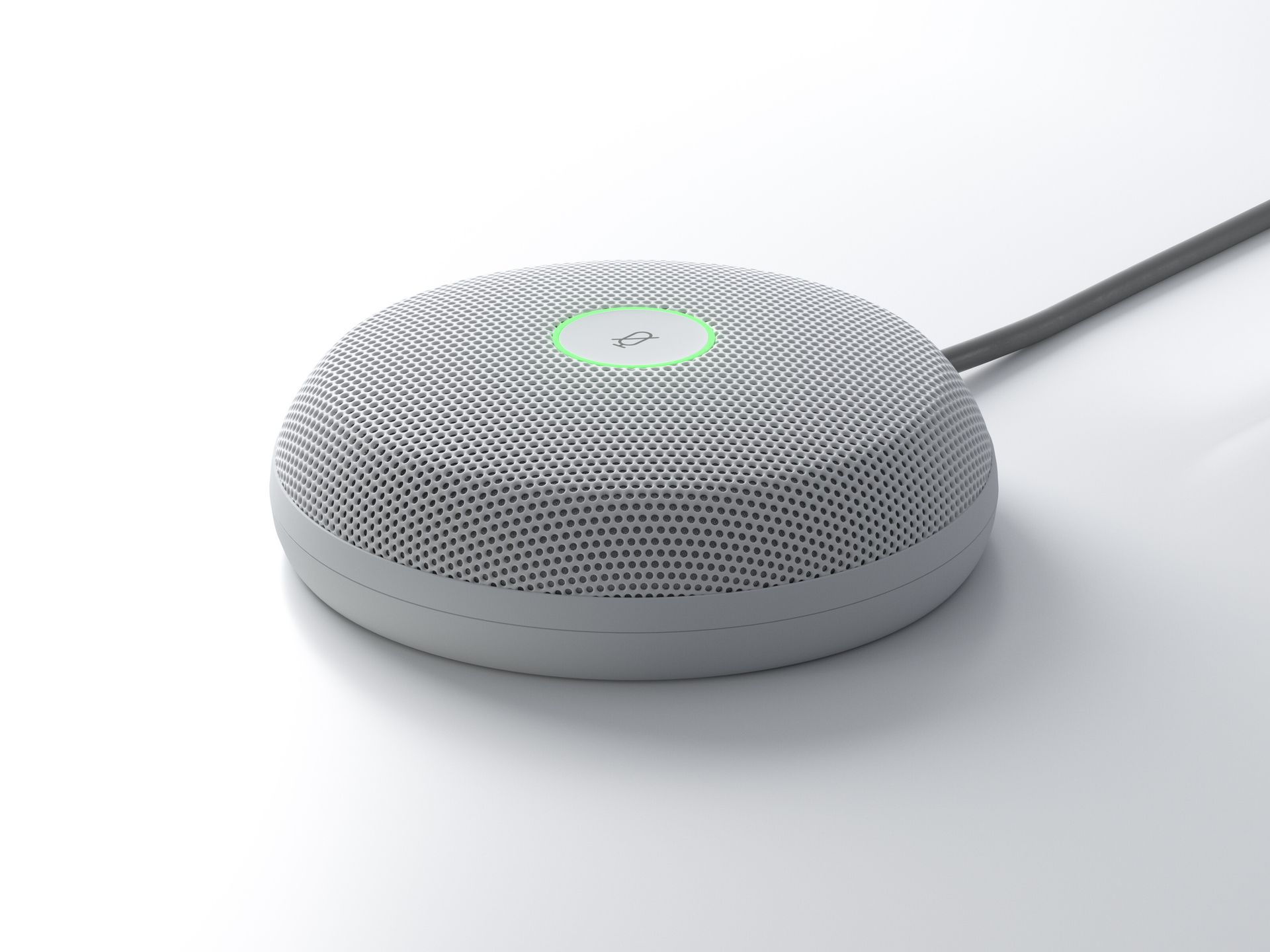 The Cisco Table Microphone Pro with a mute button in the center with a thin glowing green ring around it.