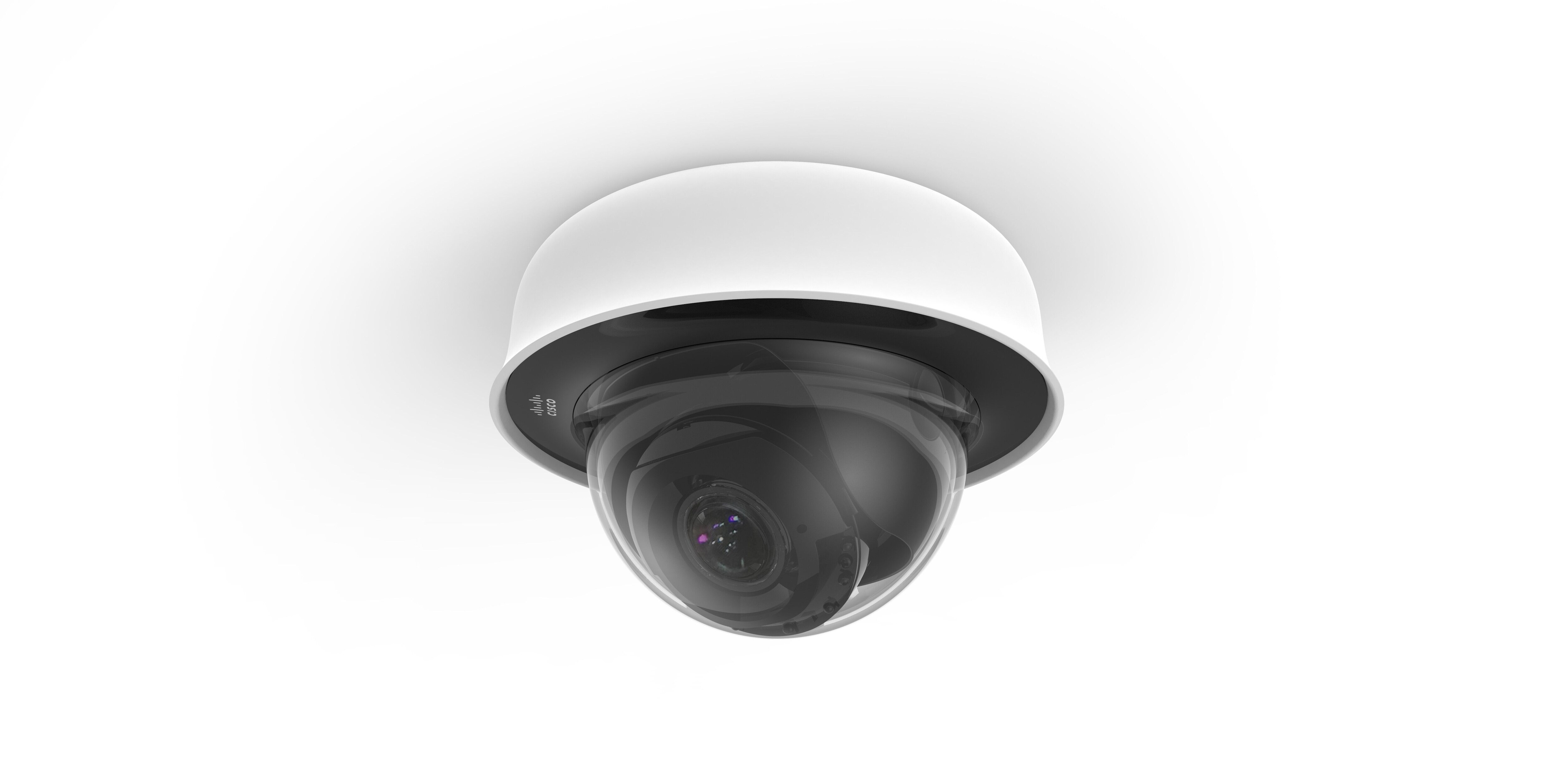 The MV22 smart camera mounted to the ceiling via its white base. The black camera is visible inside its clear dome covering.