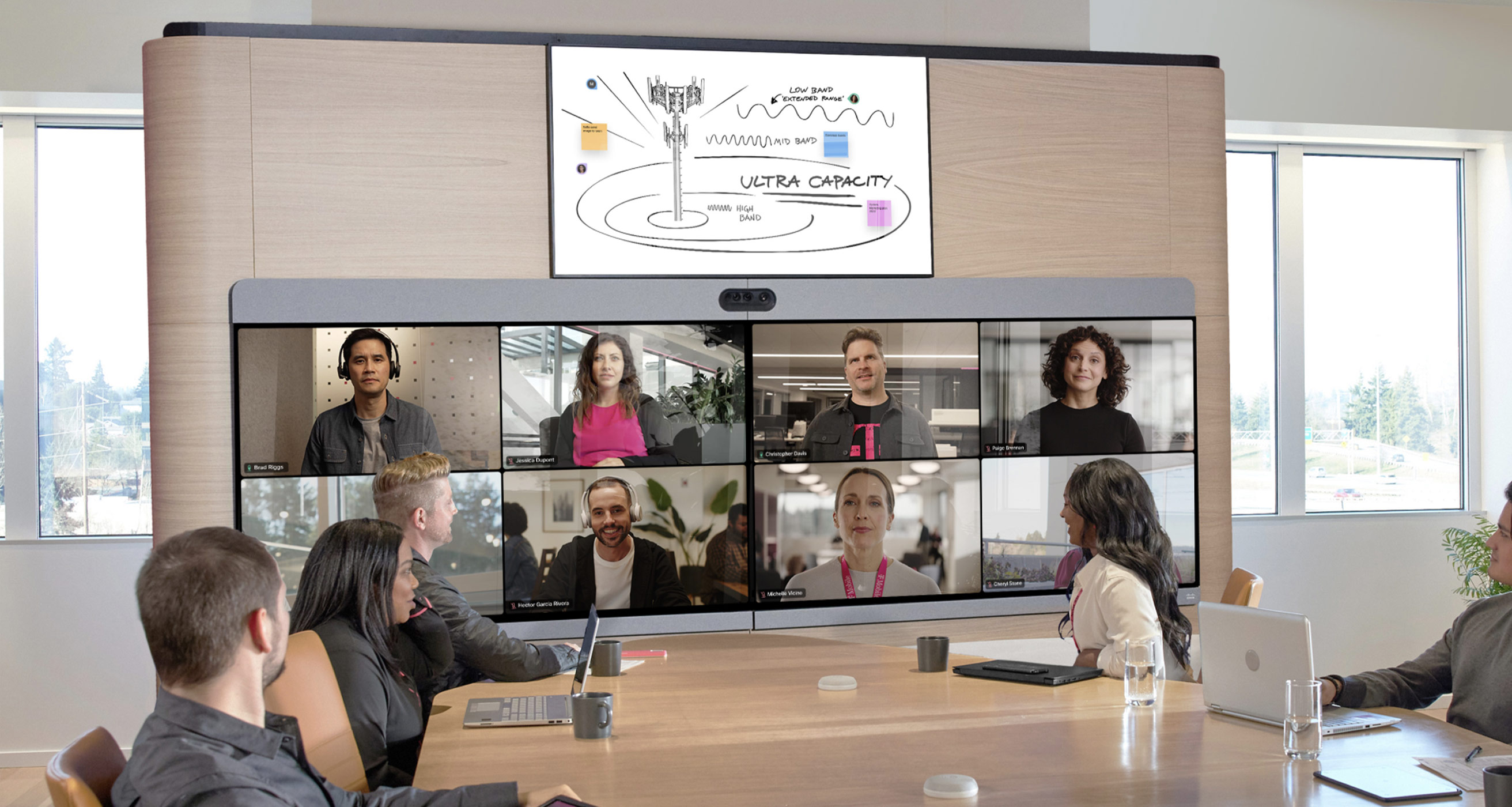 T-Mobile employees collaborate in a meeting and whiteboard their ideas with the help of Webex.