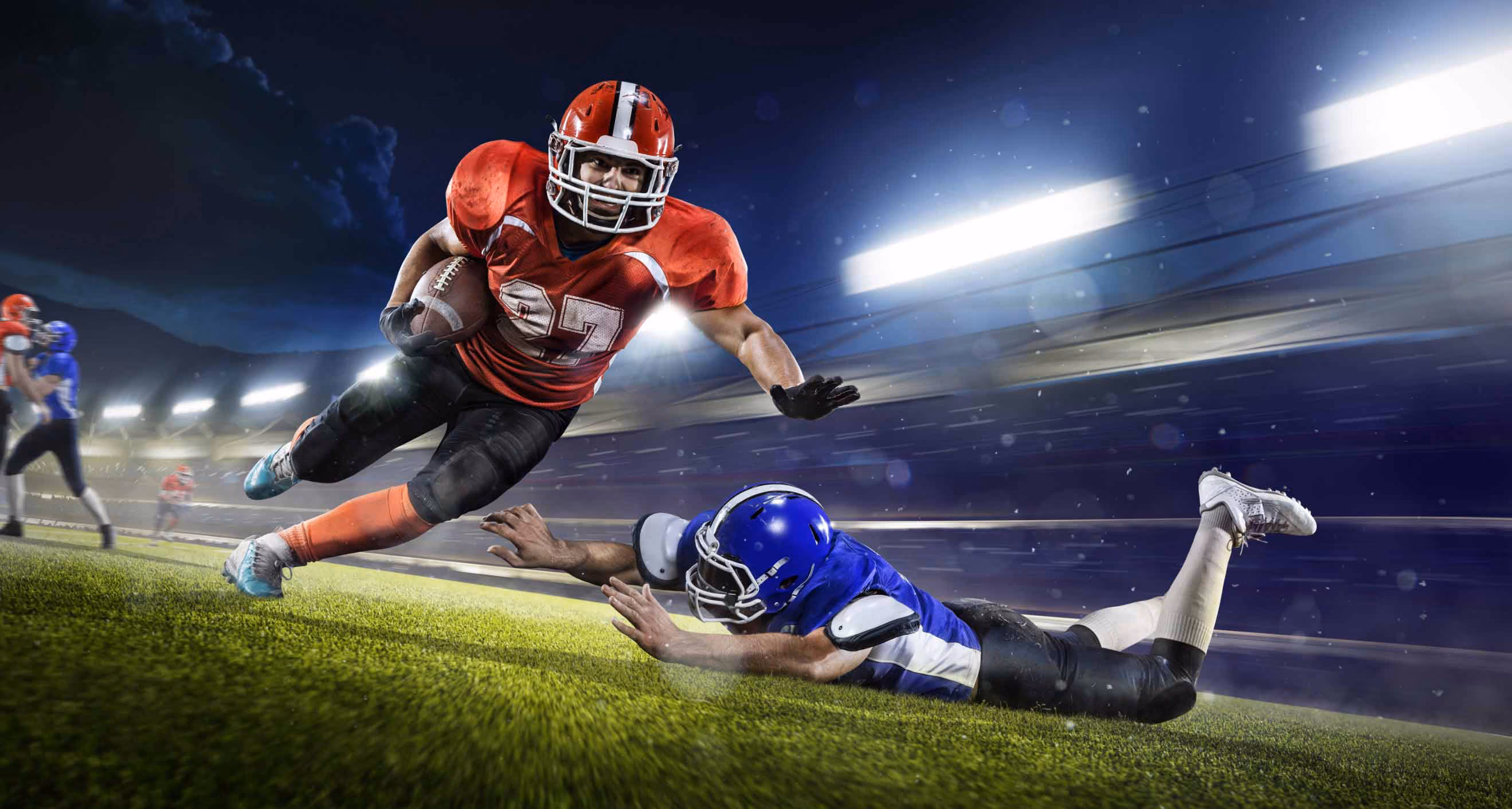 Football player runs across field