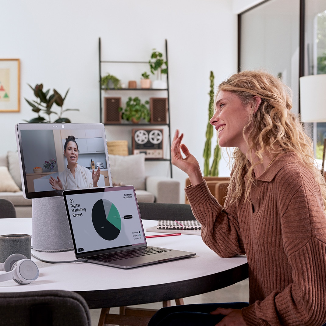 Remote worker uses Cisco Desk Mini for Webex video conference.